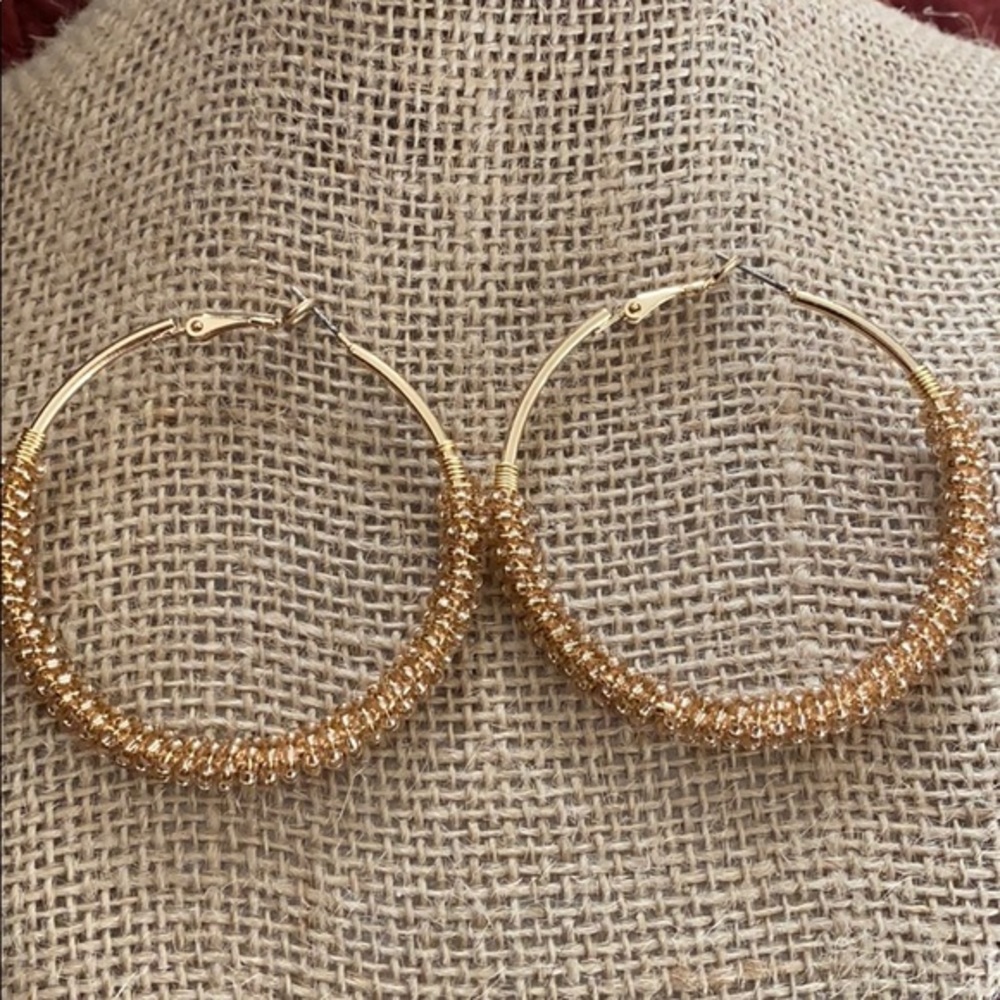 Gold hoop earrings with beading details